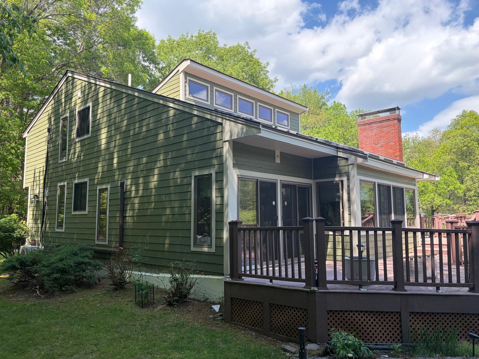 Completed full-home James Hardie fiber cement re-side by Alfa Construction in Carlisle, Massachusetts