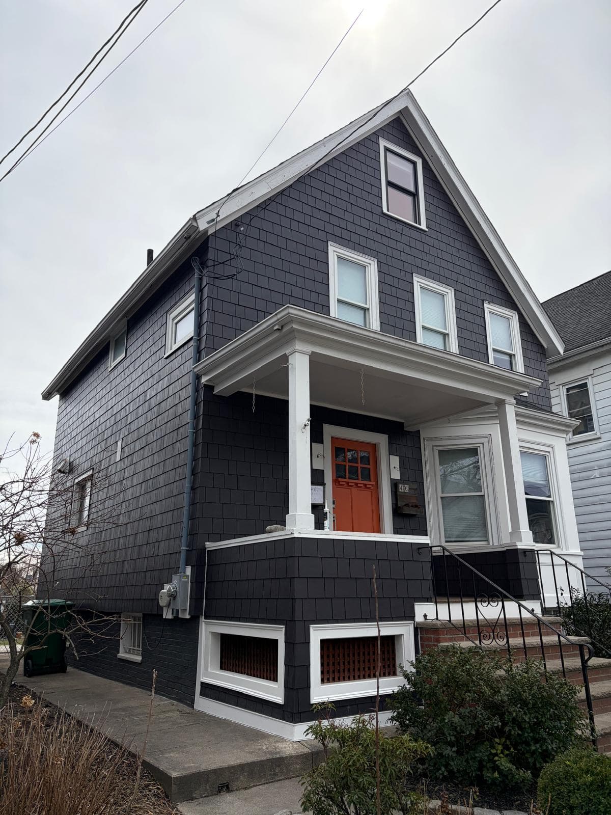 Professional dark shake siding renovation by Alfa Construction Inc in Massachusetts