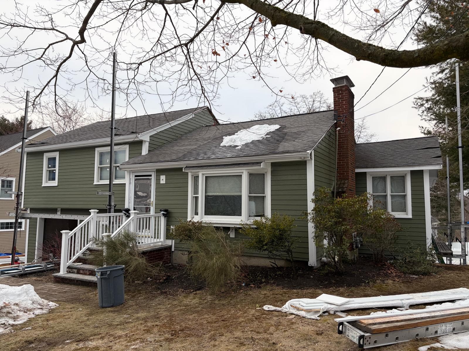 Alfa Construction Inc siding project - green siding and deck build in Massachusetts